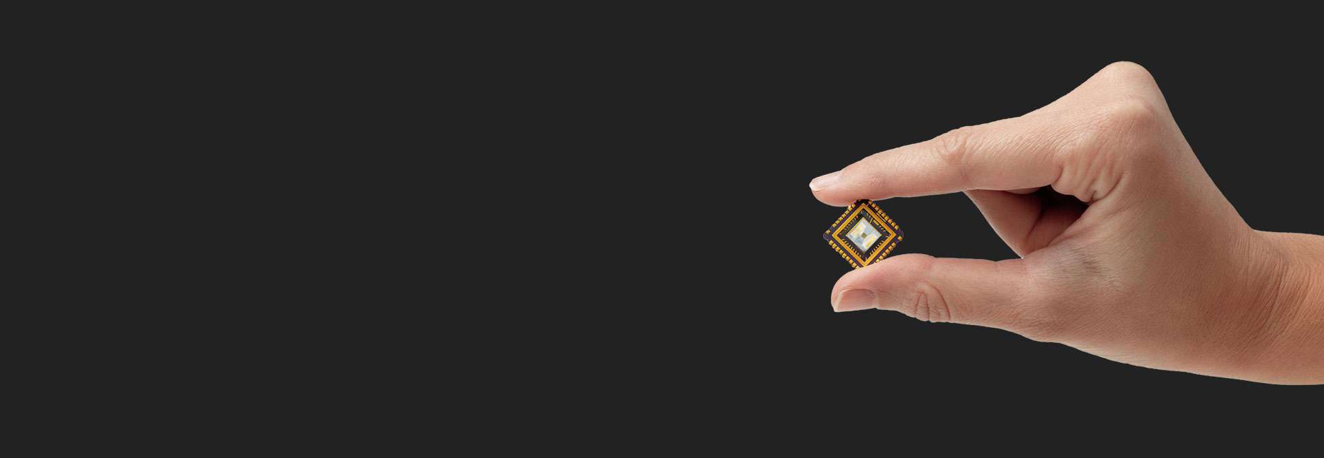 Hand holding FAIMS microchip